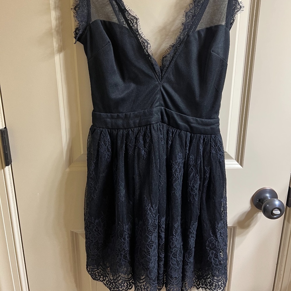 Black Tobi Skater dress with lace and tulle on the bottom. XS